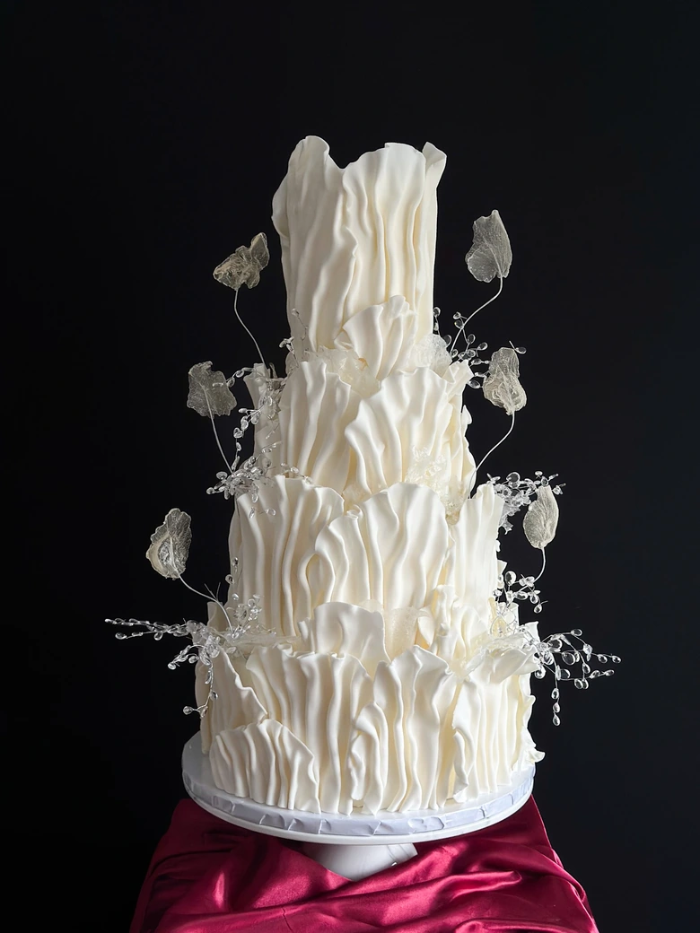 Sculpted ruffle wedding cake with crystallised detailing